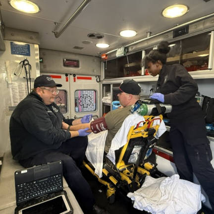 Dayton Paramedics Assisting a Patient in an Ambulance Dayton paramedics assisting a patient in an ambulance.